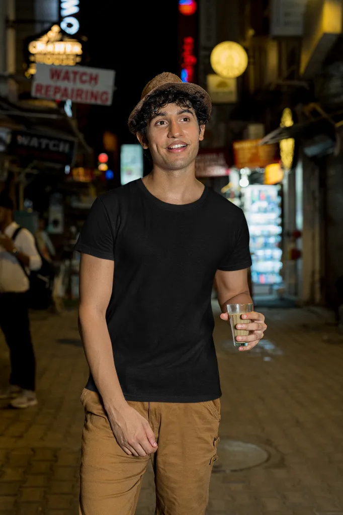 gildan-t-shirt-mockup-of-a-man-walking-with-a-drink-on-a-street-m30319.webp