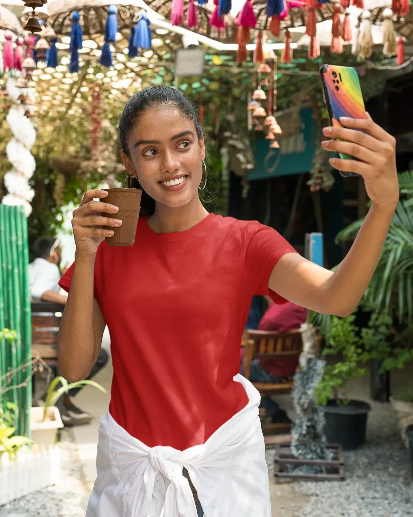 mockup-of-a-gildan-t-shirt-featuring-a-woman-taking-a-selfie-while-holding-a-glass-in-the-street-m30298.webp