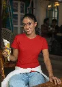 gildan-t-shirt-mockup-of-a-smiling-woman-posing-with-an-indian-snack-m30305.webp