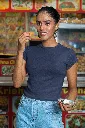 gildan-t-shirt-mockup-of-a-smiling-woman-eating-indian-food-on-the-street-m30330 (1).webp