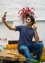 mockup-of-a-man-in-a-gildan-tee-taking-a-selfie-of-him-with-a-street-food-snack-m30296 (1).webp