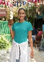 gildan-tee-mockup-featuring-a-happy-woman-holding-a-ceramic-glass-in-the-street-m30297 (1).webp