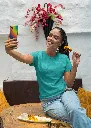 gildan-t-shirt-mockup-of-a-happy-woman-taking-a-selfie-and-eating-indian-food-m30294 (1).webp