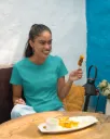 gildan-t-shirt-mockup-featuring-a-smiling-woman-eating-street-indian-food-m30293 (1).webp