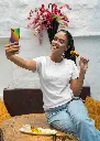 gildan-t-shirt-mockup-of-a-happy-woman-taking-a-selfie-and-eating-indian-food-m30294 (2).webp