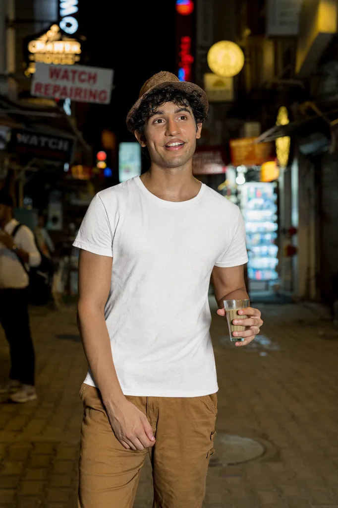 gildan-t-shirt-mockup-of-a-man-walking-with-a-drink-on-a-street-m30319 (2).webp