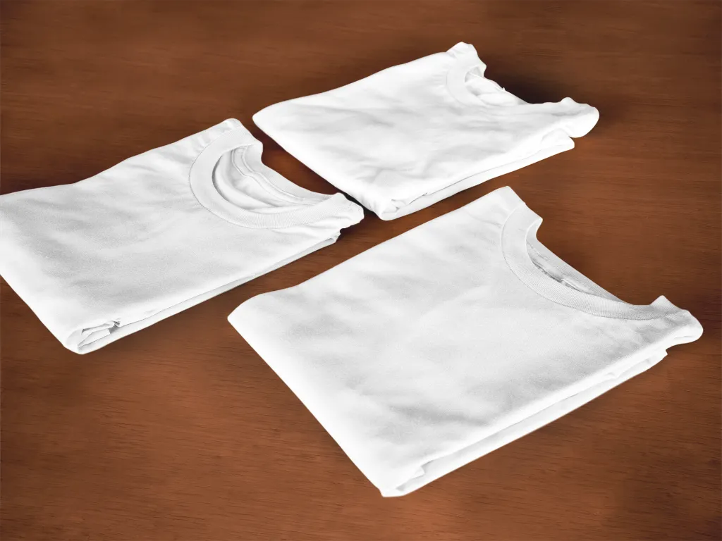 folded-t-shirts-mockup-lying-on-top-of-a-wooden-surface6482a (1).webp
