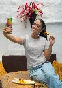 gildan-t-shirt-mockup-of-a-happy-woman-taking-a-selfie-and-eating-indian-food-m30294 (5).webp