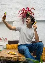 mockup-of-a-man-in-a-gildan-tee-taking-a-selfie-of-him-with-a-street-food-snack-m30296 (2).webp