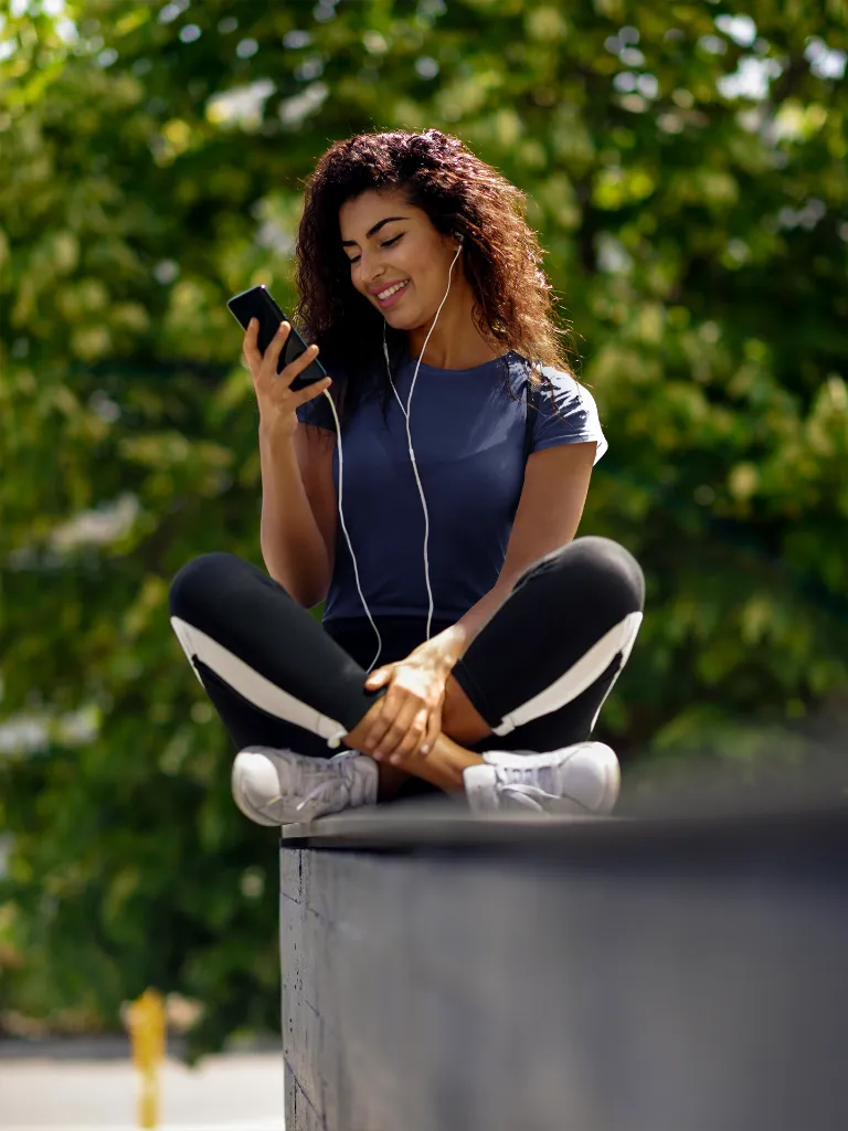 t-shirt-mockup-of-a-young-woman-looking-at-her-phone-38861-r-el2 (2).webp