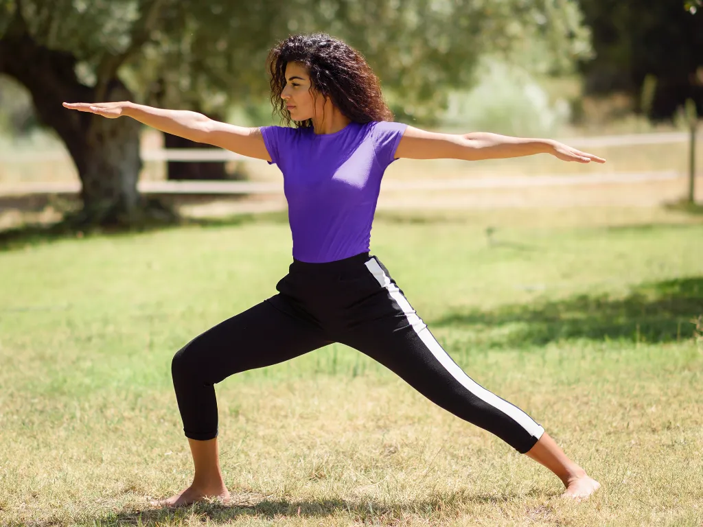 t-shirt-mockup-of-a-woman-doing-a-warrior-two-pose-in-nature-37627-r-el2 (5).webp