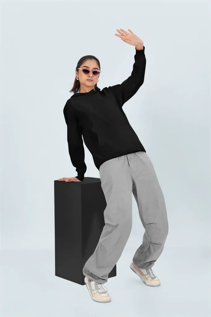 pullover-hoodie-mockup-featuring-a-woman-striking-a-pose-in-a-studio-with-a-colorful-background-m53090.webp