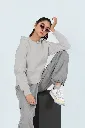 pullover-hoodie-mockup-of-a-woman-sitting-on-a-cube-while-wearing-sunglasses-m53089 (1).webp