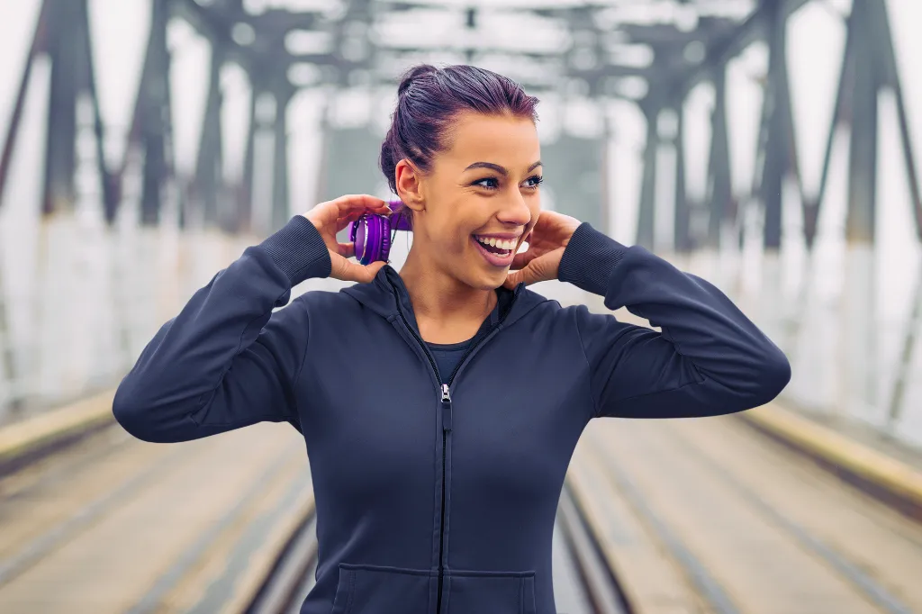 full-zip-hoodie-mockup-featuring-a-happy-woman-walking-in-a-bridge-m10555-r-el2 (2).webp