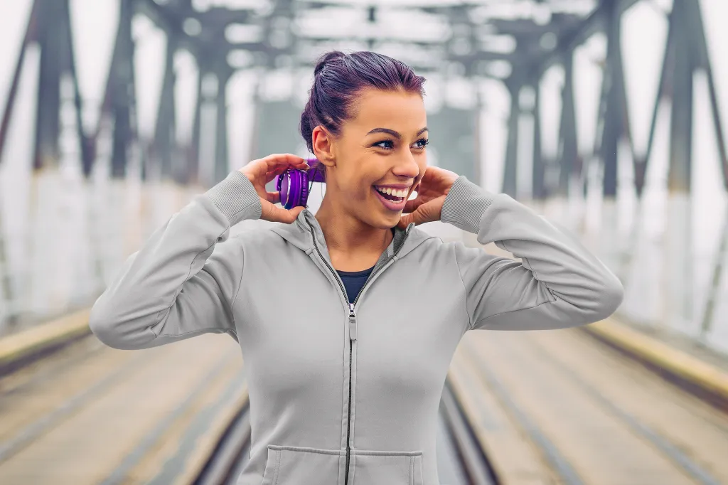 full-zip-hoodie-mockup-featuring-a-happy-woman-walking-in-a-bridge-m10555-r-el2 (1).webp