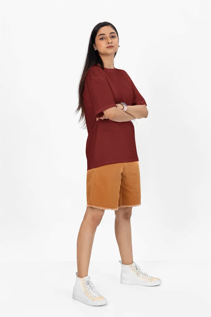 oversized-t-shirt-mockup-of-a-woman-with-arms-crossed-standing-in-a-studio-m53046 (3).webp