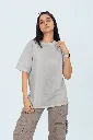 oversized-round-neck-tee-mockup-featuring-a-woman-standing-against-a-colorful-backdrop-m53034 (2).webp