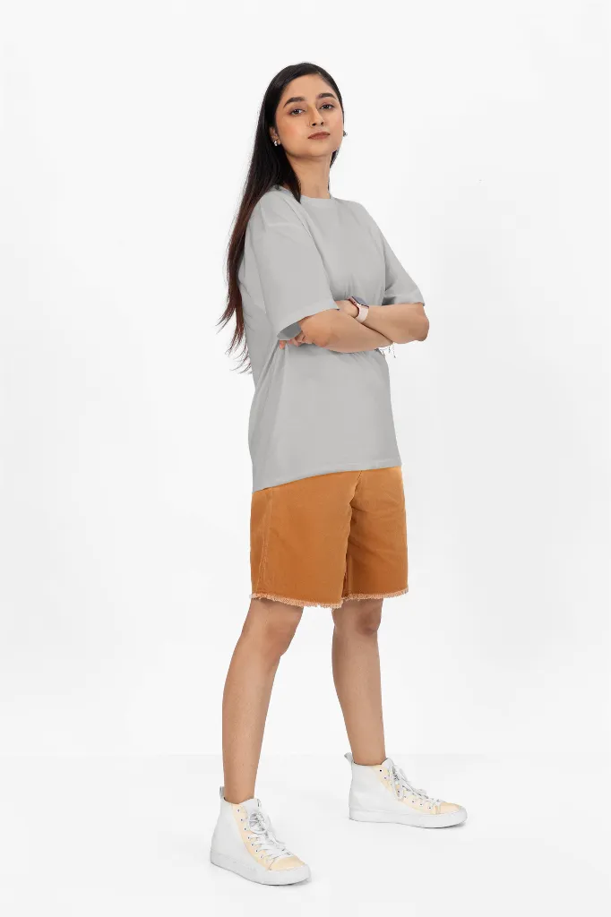 oversized-t-shirt-mockup-of-a-woman-with-arms-crossed-standing-in-a-studio-m53046 (2).webp
