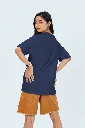 back-view-oversized-tee-mockup-of-a-woman-posing-in-a-studio-against-a-colorful-background-m53045 (1).webp