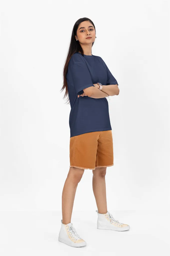 oversized-t-shirt-mockup-of-a-woman-with-arms-crossed-standing-in-a-studio-m53046 (1).webp