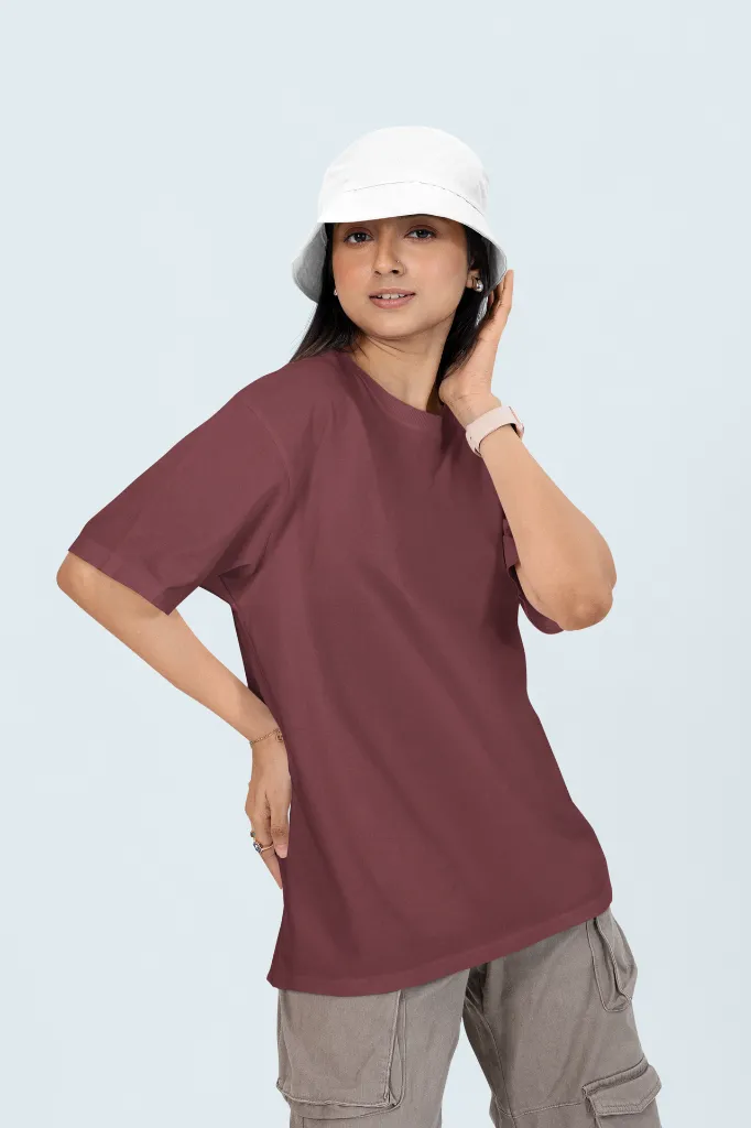 oversized-t-shirt-mockup-of-a-woman-posing-in-a-customizable-background-with-a-bucket-hat-m53042.webp