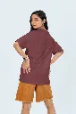 back-view-oversized-tee-mockup-of-a-woman-posing-in-a-studio-against-a-colorful-background-m53045.webp