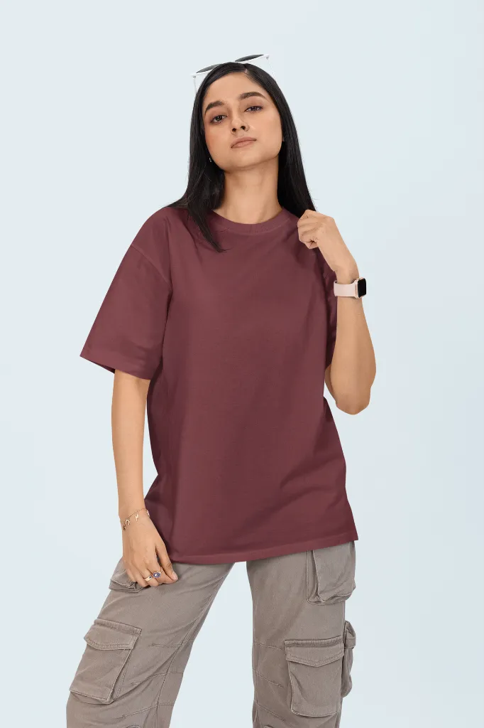 oversized-round-neck-tee-mockup-featuring-a-woman-standing-against-a-colorful-backdrop-m53034.webp