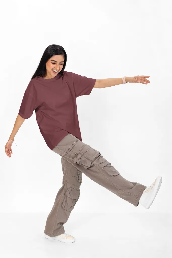 oversized-tee-mockup-featuring-a-cheerful-woman-having-fun-in-a-studio-m53035.webp