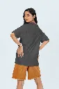 back-view-oversized-tee-mockup-of-a-woman-posing-in-a-studio-against-a-colorful-background-m53045 (10).webp
