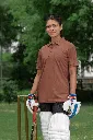 polo-shirt-mockup-of-a-smiling-woman-wearing-cricket-equipment-m39963.webp