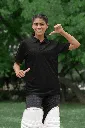 cricket-themed-mockup-of-a-happy-woman-pointing-at-her-gildan-polo-shirt-m39966 (1).webp