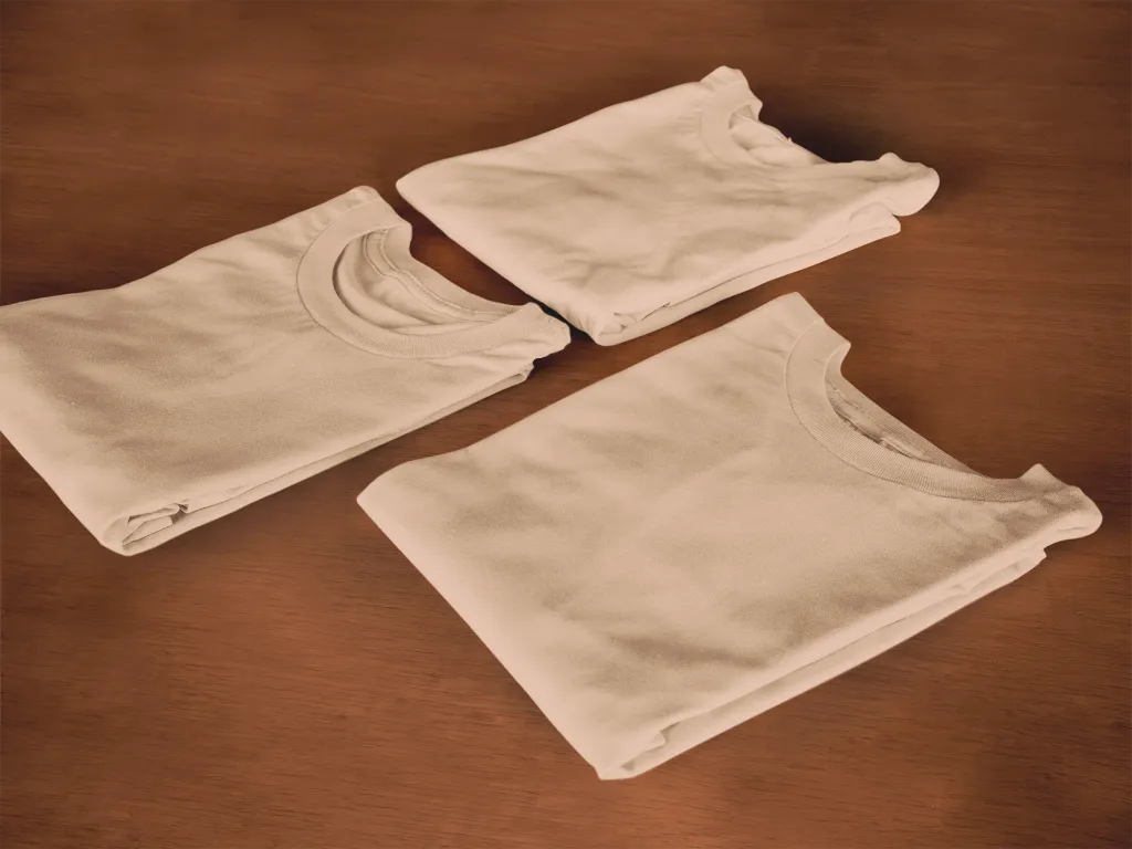 folded-t-shirts-mockup-lying-on-top-of-a-wooden-surface6482a.webp